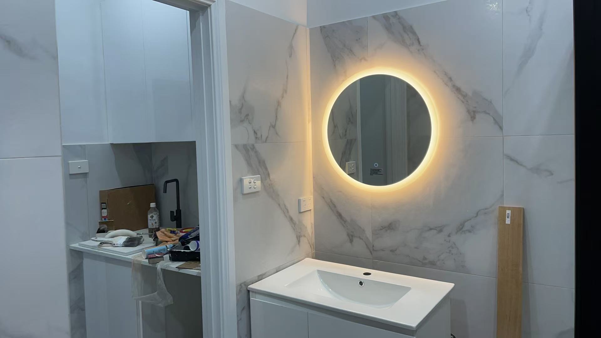 Illuminated vanity and stone-look finish